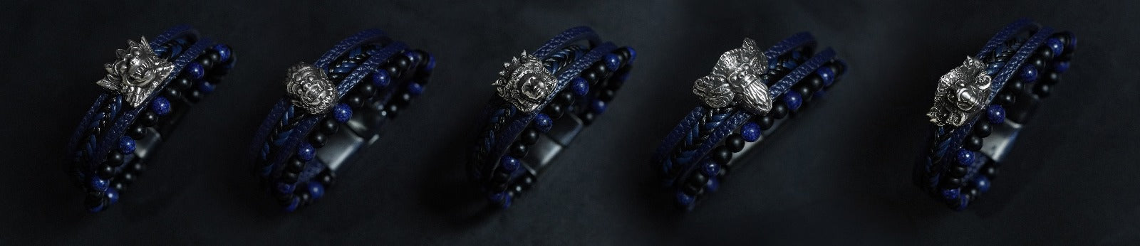 The five Mythical Figures of Bali bracelets with silver figures and dark blue cords