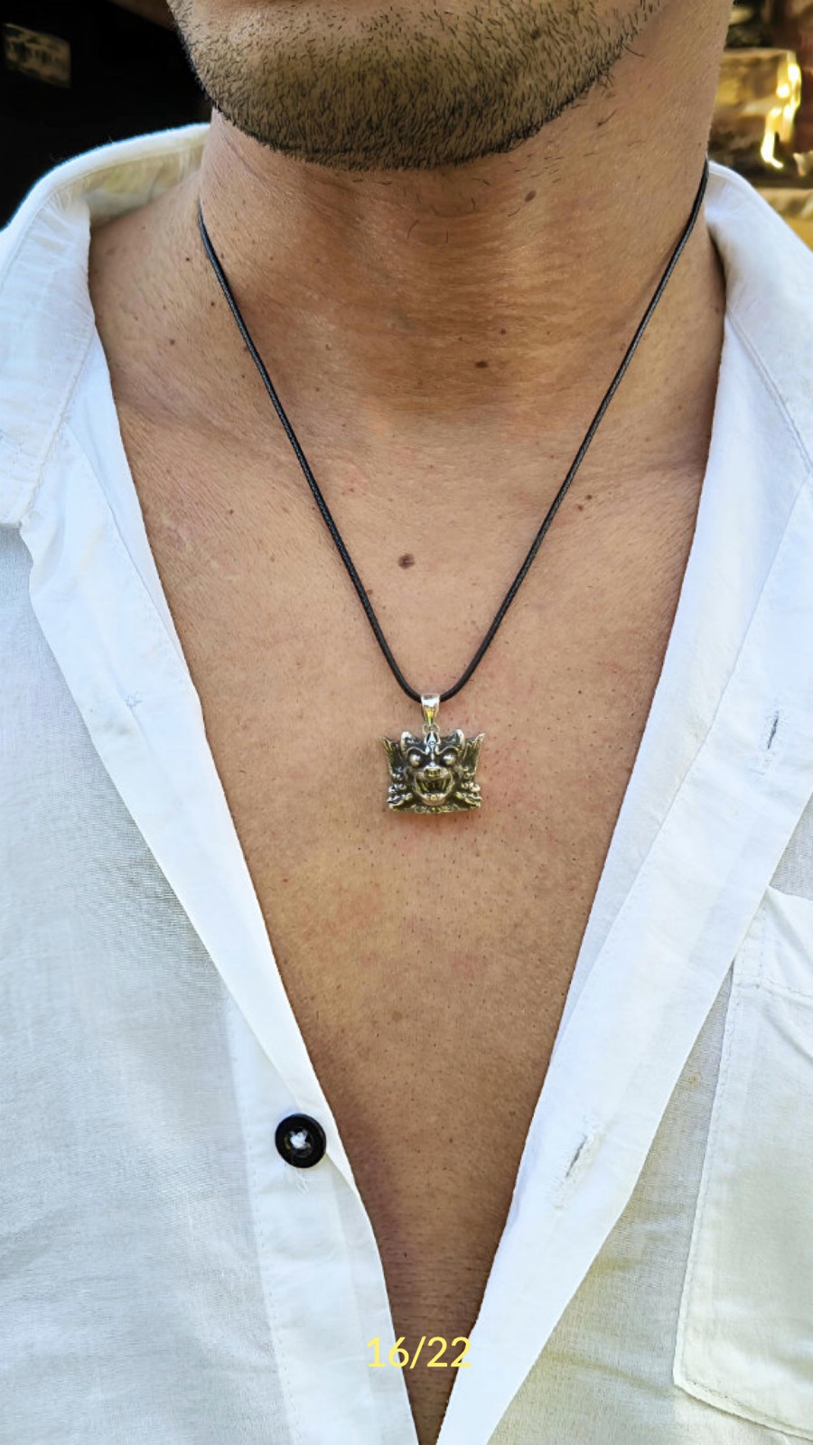 A Mythical Figures of Bali pendant worn by a man