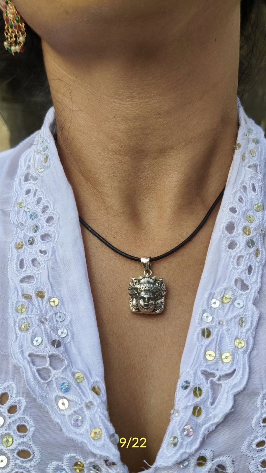 A Mythical Figures of Bali pendant worn by a woman