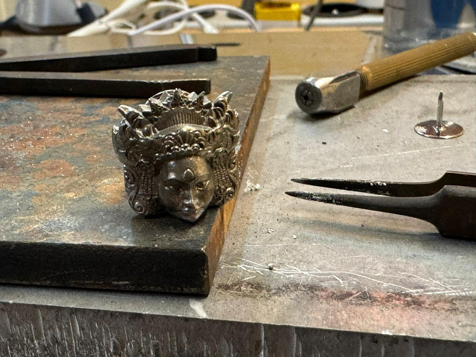 Pendant and hand tools on a Celuk workbench